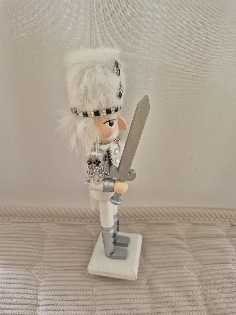White and Silver Nutcracker Figurine with Faux Fur Hat